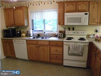3801 Concord Road Aston, PA 19014 - Photo 6 of 12 a kitchen with stainless steel appliances a stove a sink and a microwave