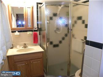 3801 Concord Road Aston, PA 19014 - Photo 10 of 12 a bathroom with a sink vanity mirror and toilet