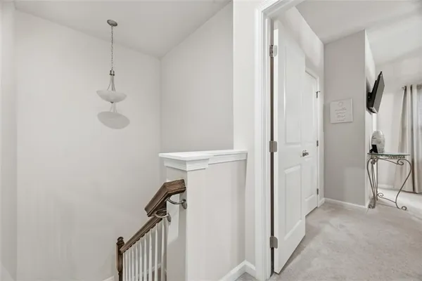 a view of a hallway with closet