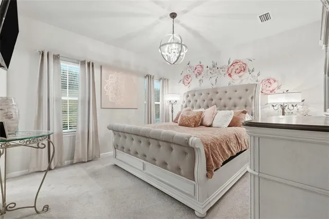 a bed room with a bed and a window