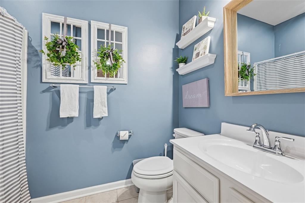 102 Rivulet Place Zelienople, PA 16063 - Photo 27 of 35 a bathroom with a toilet a sink and a window