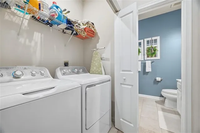 a view of bathroom with a washer and dryer