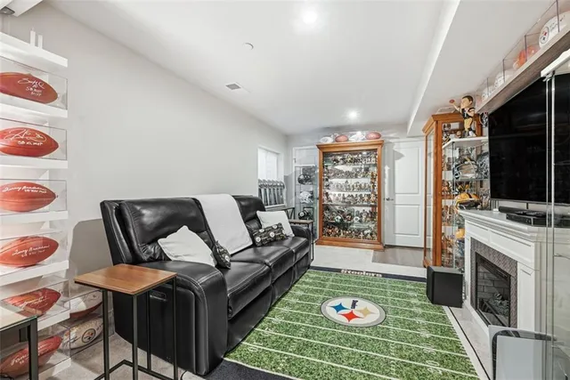 a living room with furniture and a fireplace