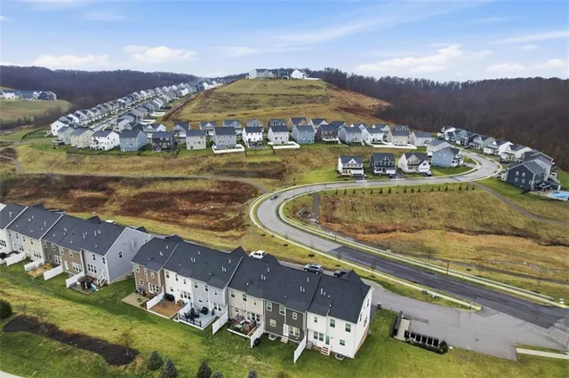 a view of swimming pool with outdoor seating and plants