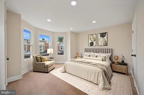 a bedroom with bed and furniture