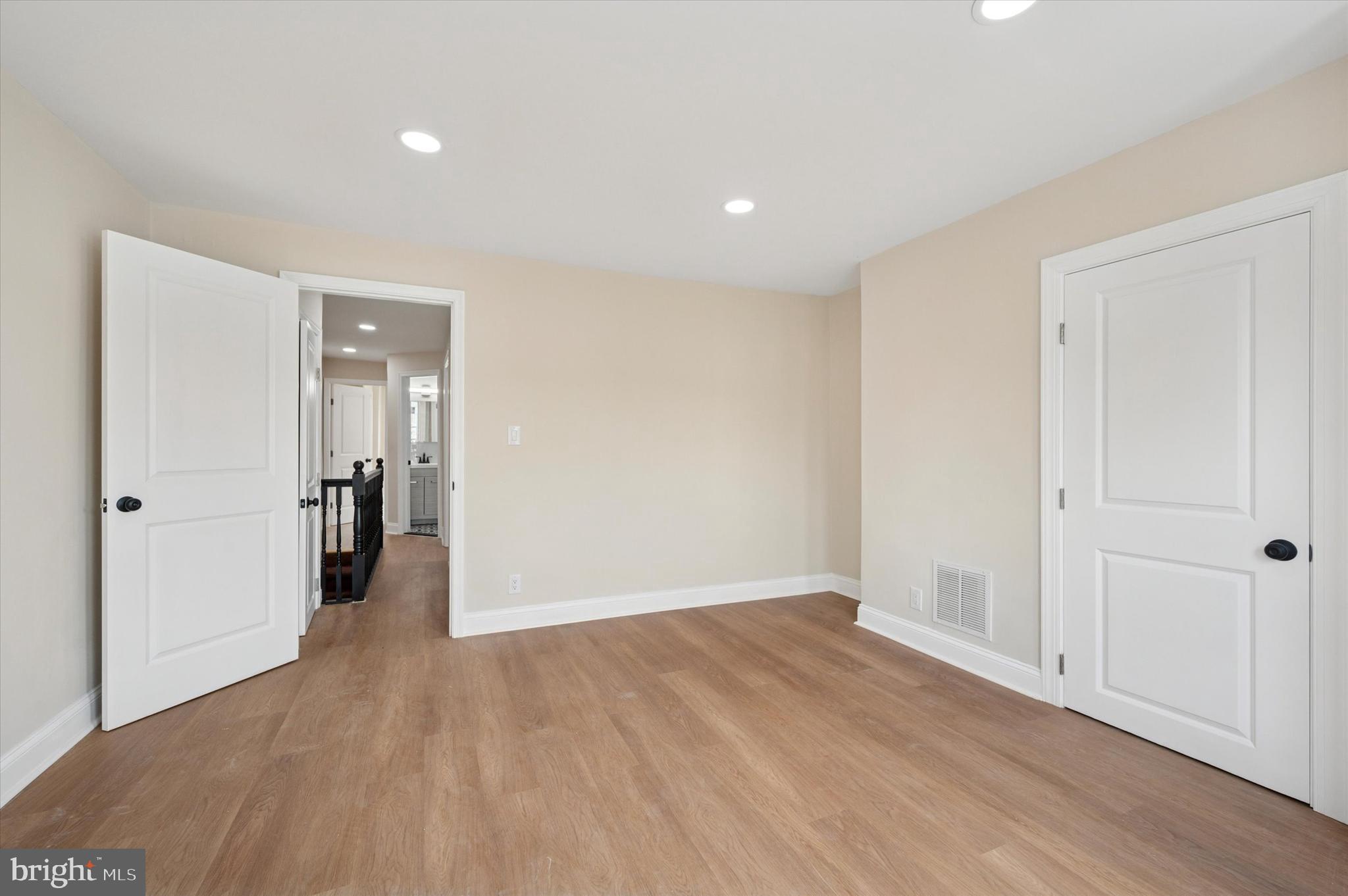 5617 Walton Avenue Philadelphia, PA 19143 - Photo 19 of 28 a view of a big room with wooden floor and windows