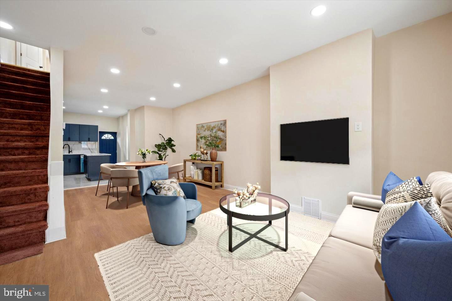 5617 Walton Avenue Philadelphia, PA 19143 - Photo 2 of 28 a living room with furniture and a flat screen tv