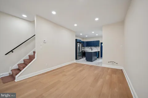 a view of a kitchen with a sink and cabinets