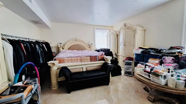 a utility room with dryer washer and a view of living room