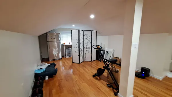 a bedroom with a bed and cabinets