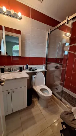 a bathroom with a double vanity sink and a mirror