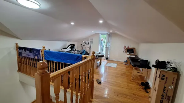 a spacious bedroom with a bed and a couch