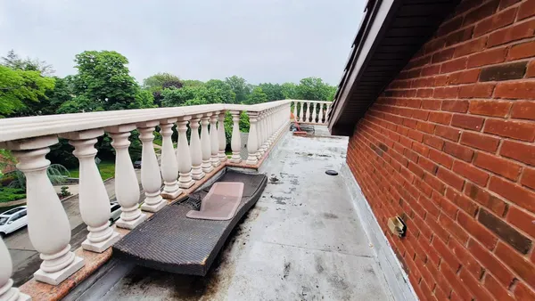 a view of a house with a yard patio and sitting area