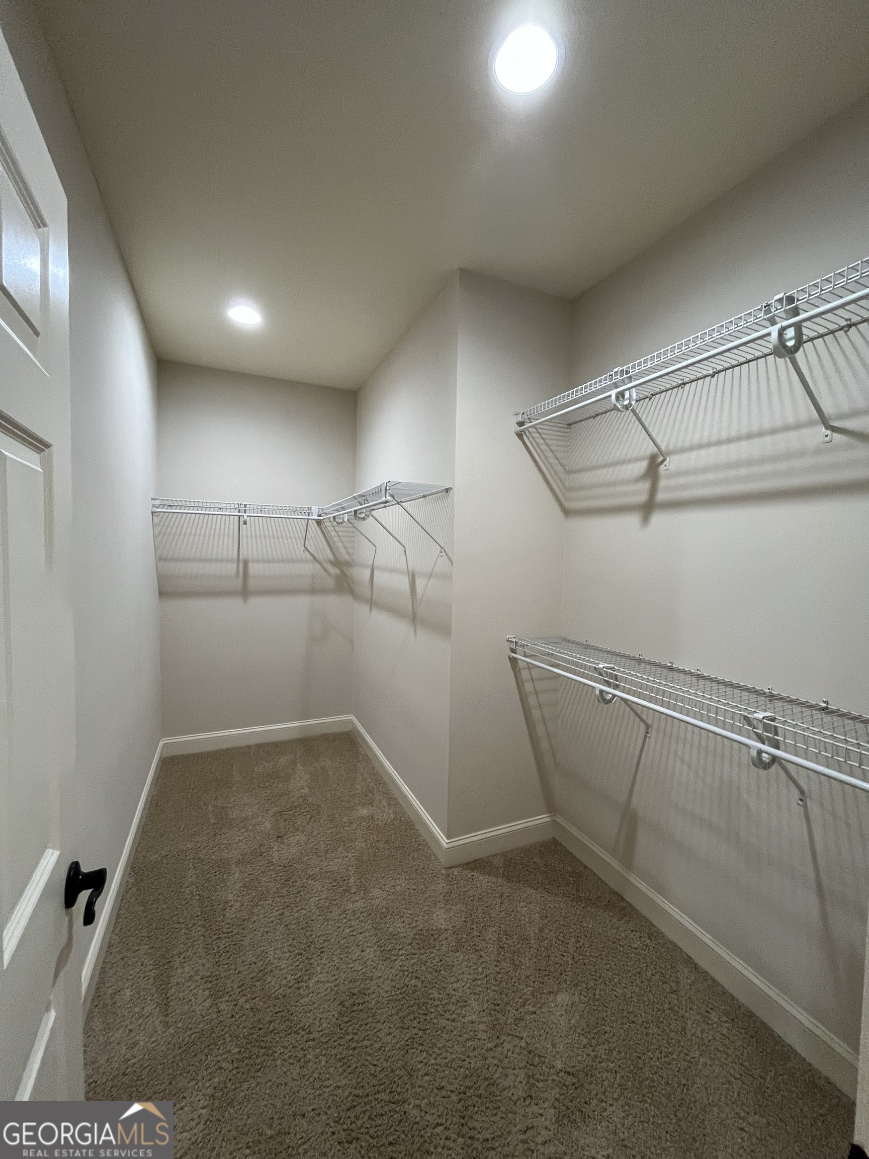 708 Osborne Street, Unit 206 St. Marys, GA 31558 - Photo 15 of 27 a view of a room with racks on the wall