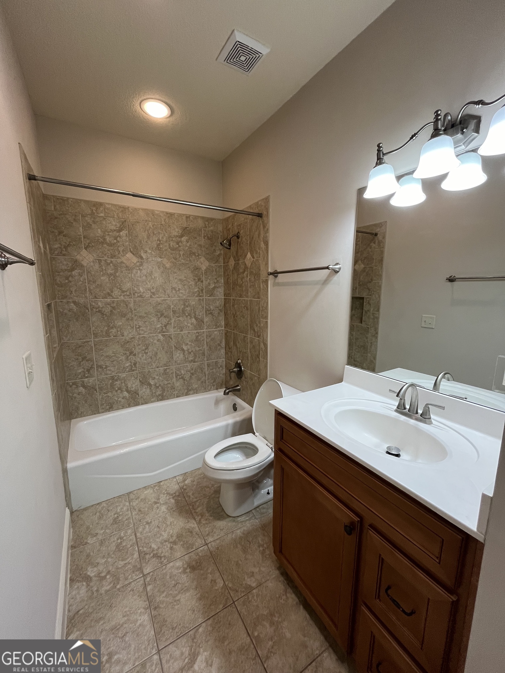 708 Osborne Street, Unit 206 St. Marys, GA 31558 - Photo 16 of 27 a bathroom with a sink a toilet and shower