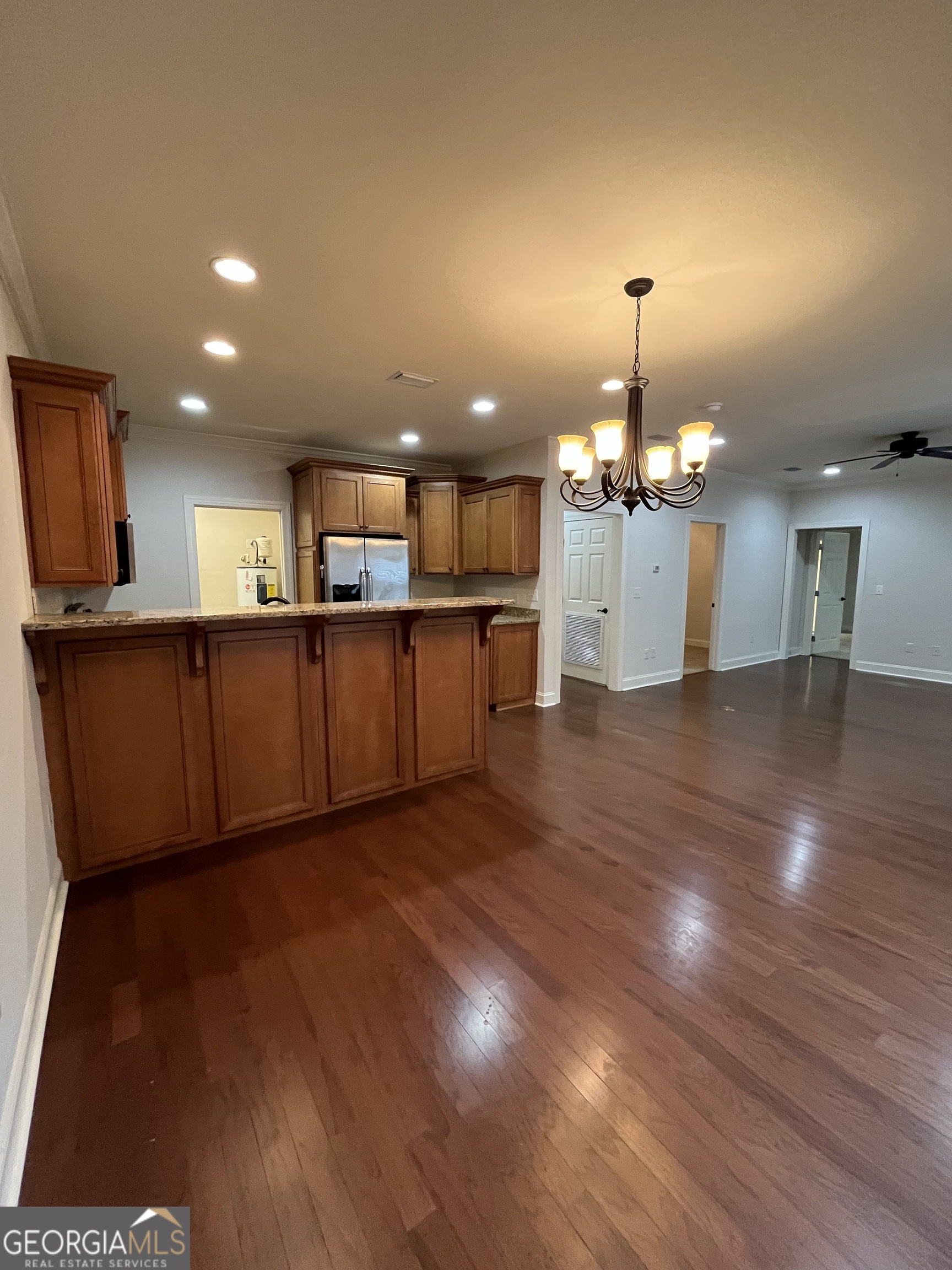 708 Osborne Street, Unit 206 St. Marys, GA 31558 - Photo 8 of 27 a view of a kitchen with a sink and a refrigerator
