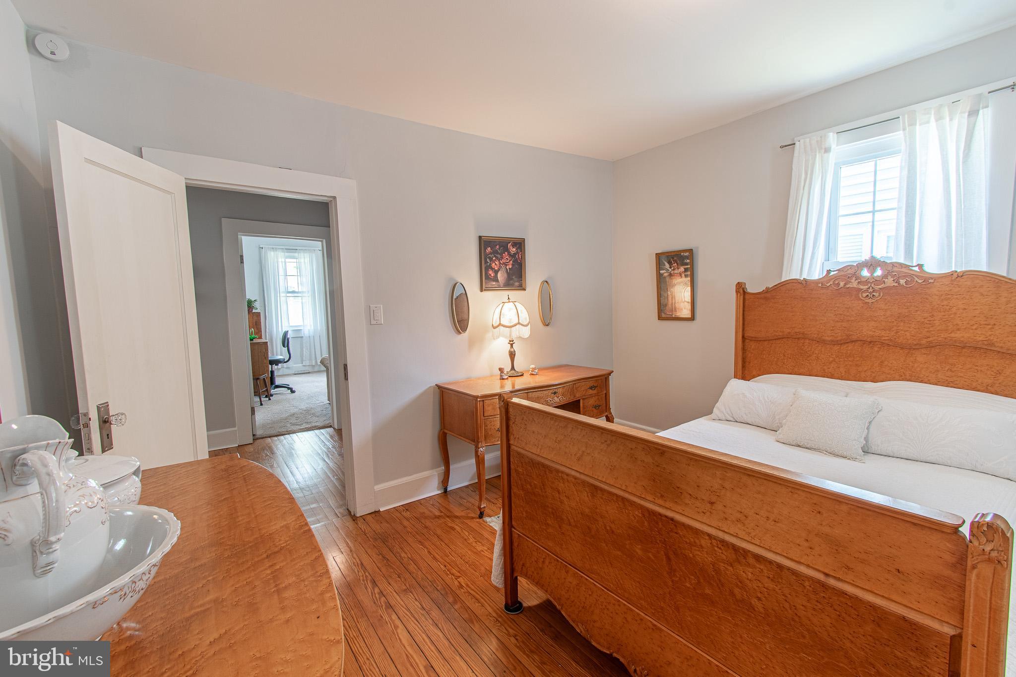 207 Crusader Road Cambridge, MD 21613 - Photo 39 of 76 a bedroom with a bed and a dresser