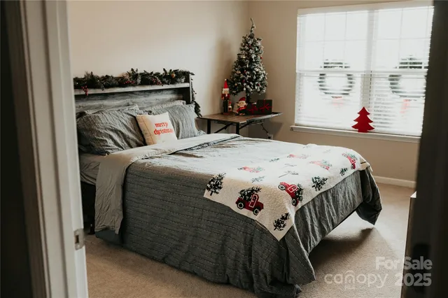 a bedroom with bed and a window