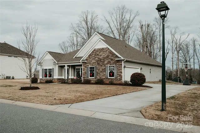 a view of a house with a yard and garage