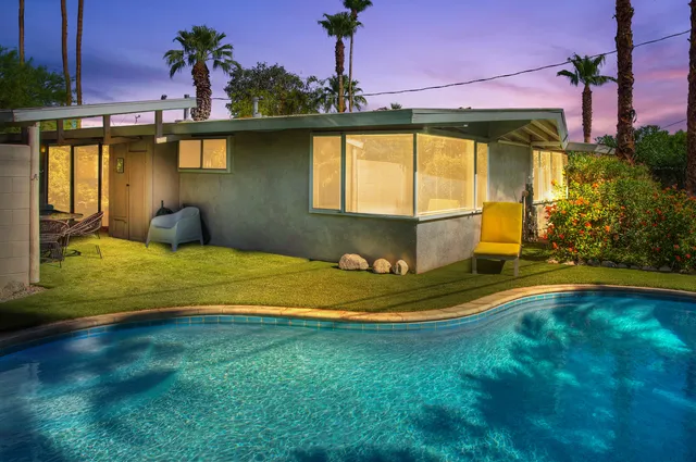 a swimming pool with yard