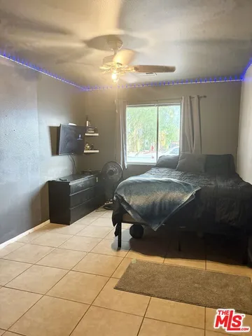 a bedroom with a bed and a cabinets