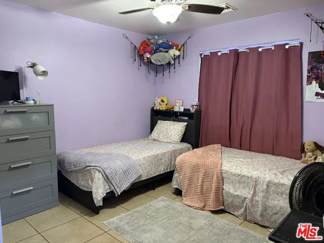 a bedroom with a bed and cabinets