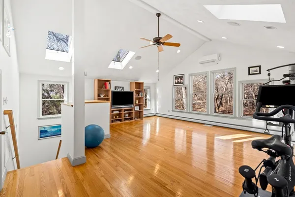 a view of a livingroom with furniture and a flat screen tv