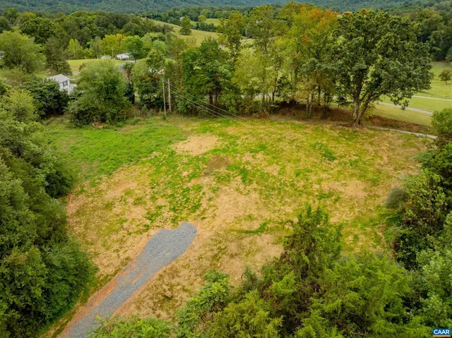 a view of a big yard with swimming pool and outdoor space