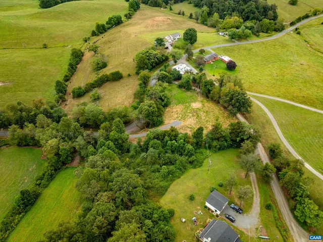 a view of a lake with a yard