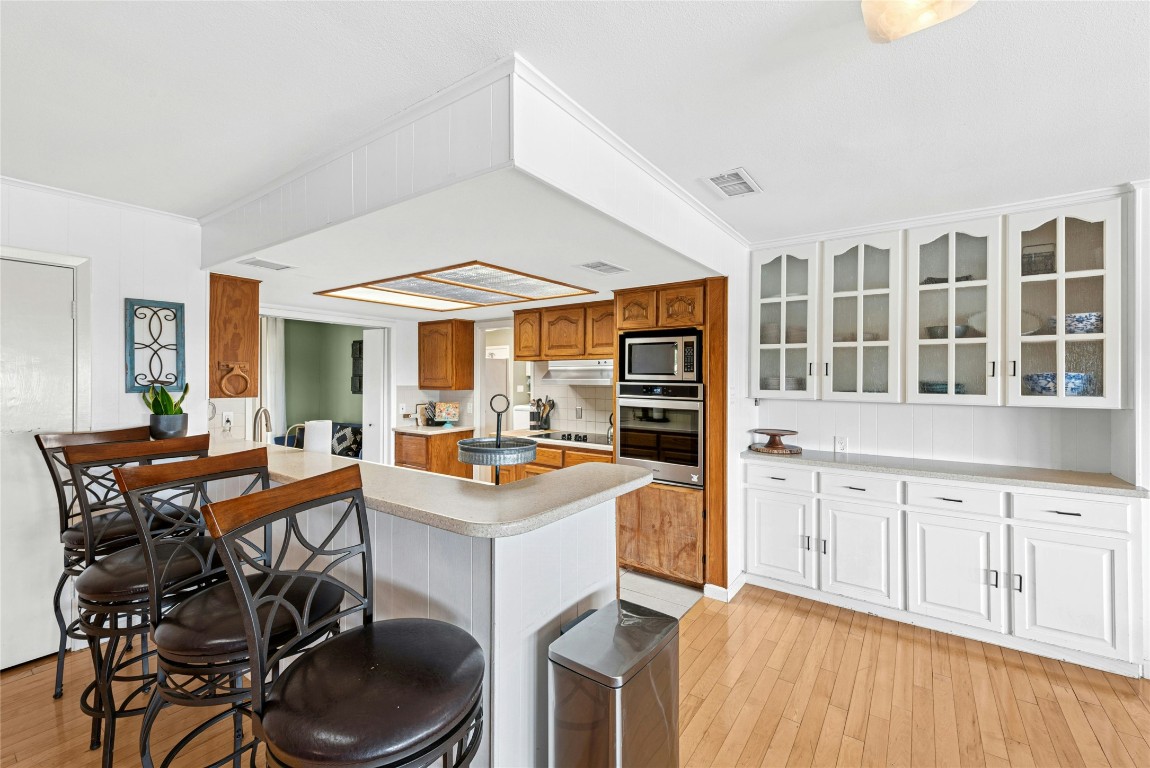 110 Longhorn Lane Dripping Springs, TX 78620 - Photo 11 of 40 a view of a kitchen and dining room