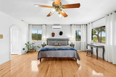 a bedroom with a bed and a table