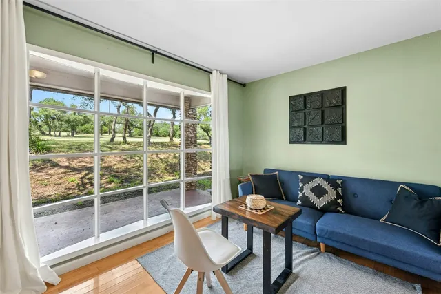 a living room with a couch and a large window