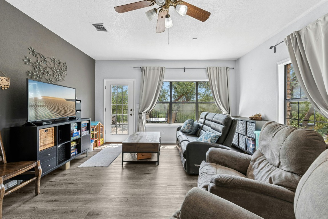 110 Longhorn Lane Dripping Springs, TX 78620 - Photo 21 of 40 a living room with furniture and a flat screen tv