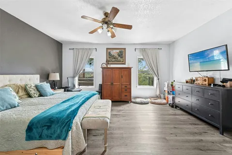 a living room with furniture and a dresser