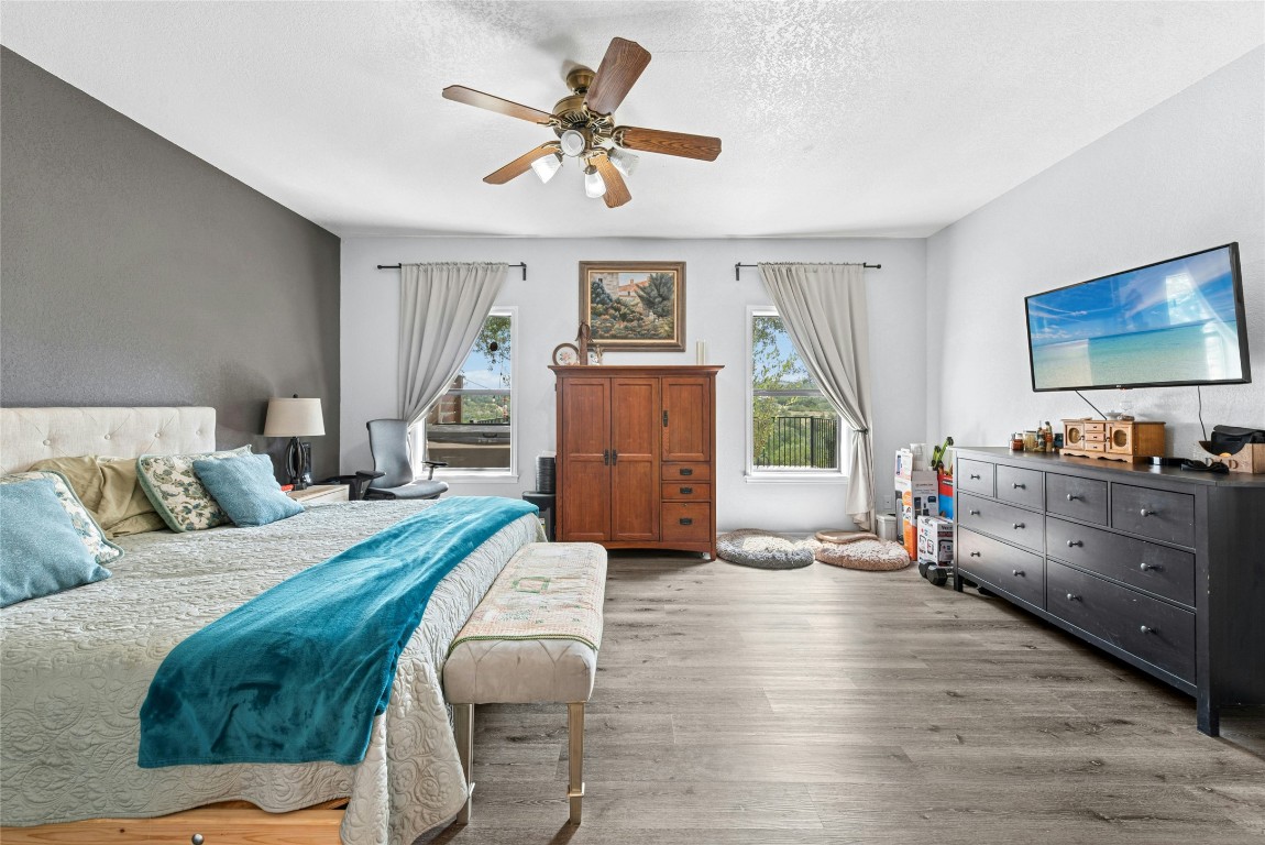 110 Longhorn Lane Dripping Springs, TX 78620 - Photo 22 of 40 a living room with furniture and a dresser