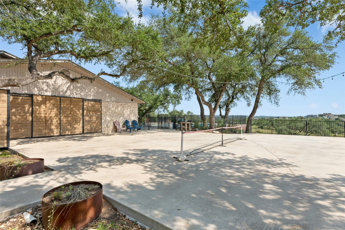 110 Longhorn Lane Dripping Springs, TX 78620 - Photo 29 of 40 a street view with large trees