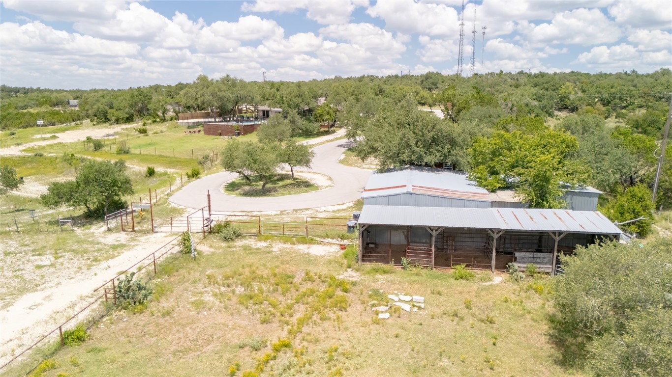 110 Longhorn Lane Dripping Springs, TX 78620 - Photo 35 of 40 a view of a lake with a garden and mountain view