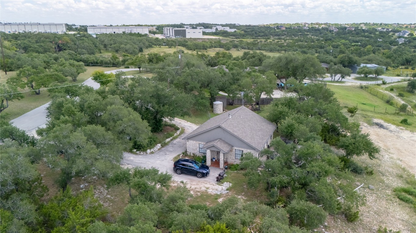 110 Longhorn Lane Dripping Springs, TX 78620 - Photo 37 of 40 an aerial view of a house with yard and outdoor seating