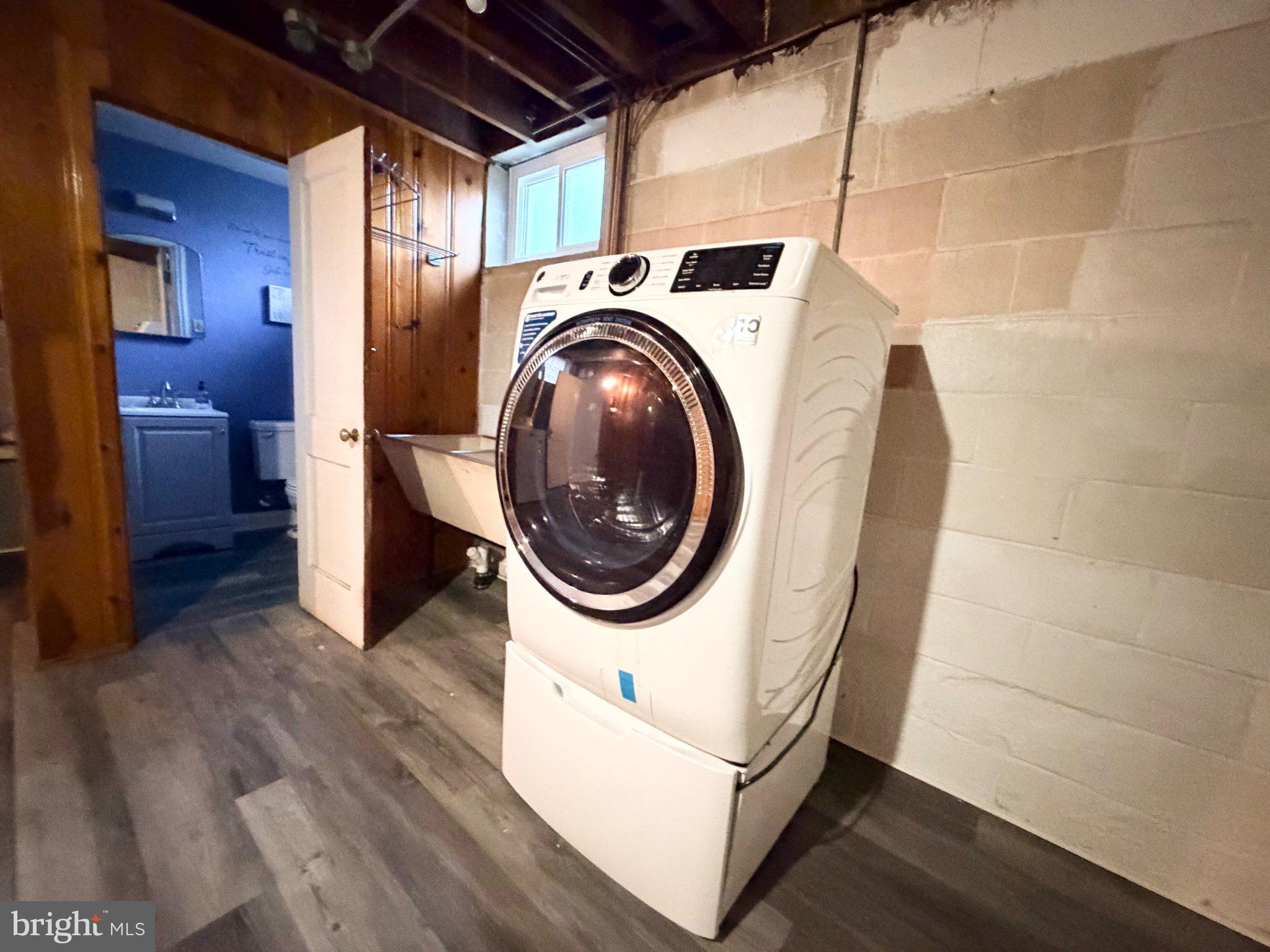 1615 Burnwood Road Baltimore, MD 21239 - Photo 80 of 83 Modern laundry space with natural light.