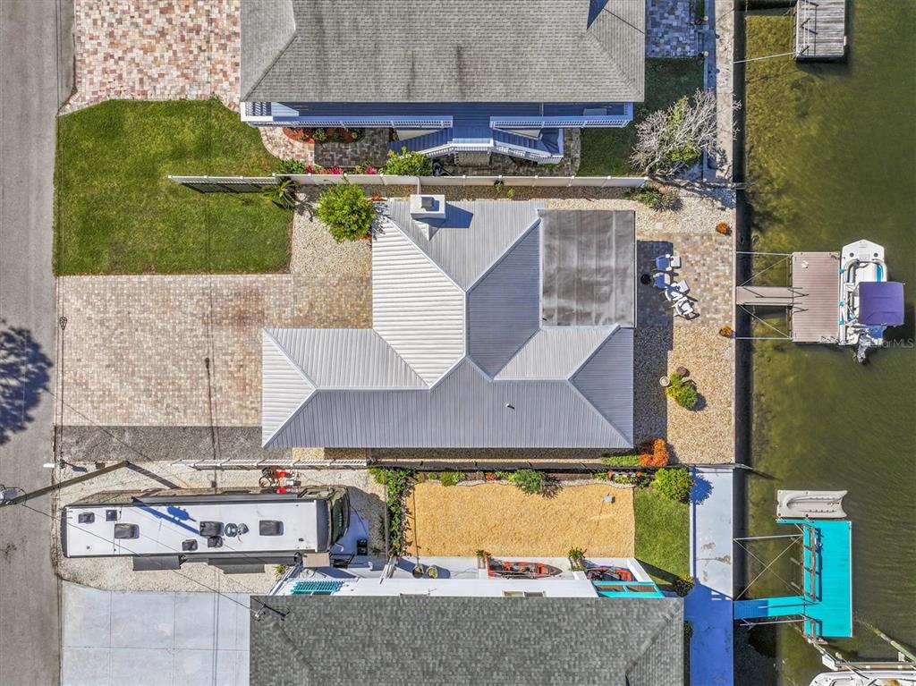 3391 Mangrove Drive Hernando Beach, FL 34607 - Photo 14 of 52 an aerial view of a house with a yard