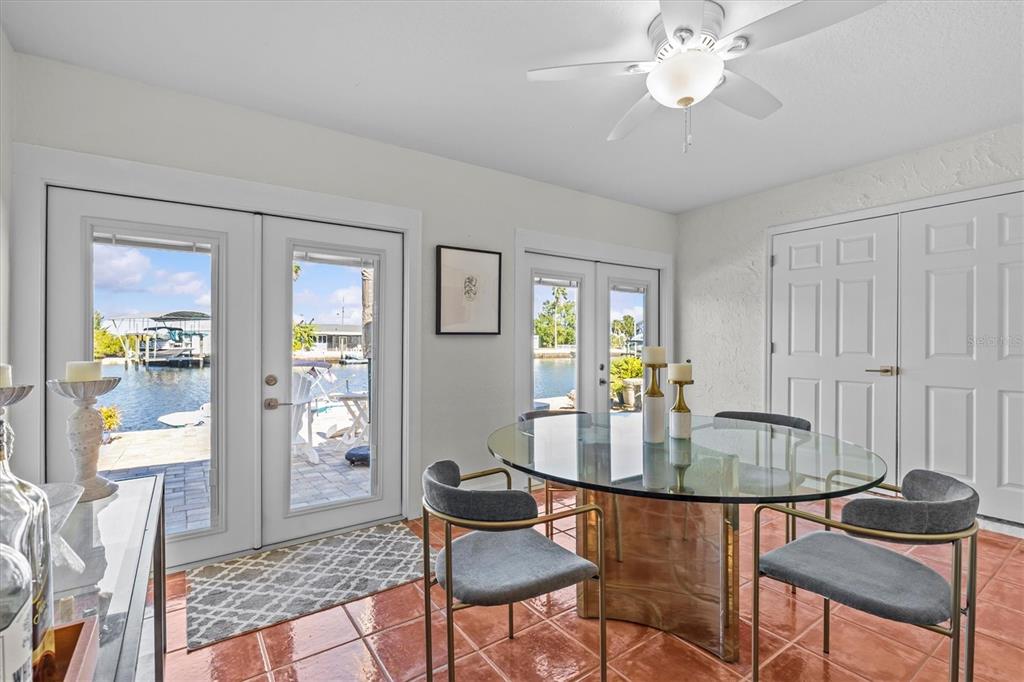 3391 Mangrove Drive Hernando Beach, FL 34607 - Photo 30 of 52 a dining room with furniture and window