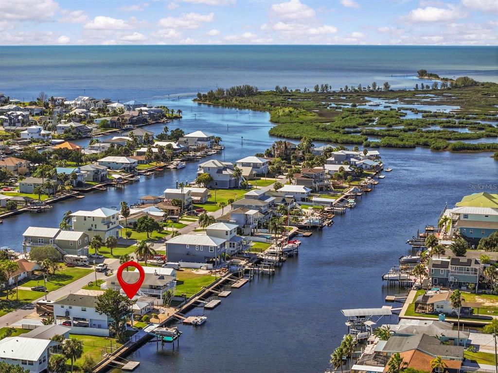 3391 Mangrove Drive Hernando Beach, FL 34607 - Photo 3 of 52 an aerial view of residential houses with outdoor space
