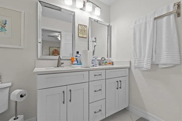 a view of room with workspace and wooden floor