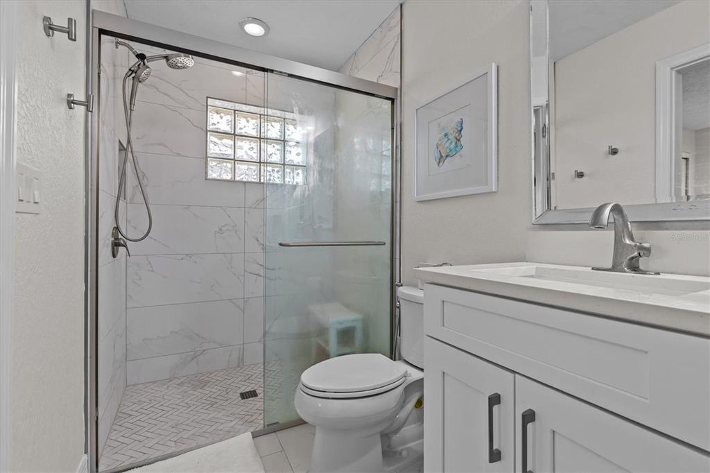 3391 Mangrove Drive Hernando Beach, FL 34607 - Photo 37 of 52 a bathroom with a sink toilet and shower