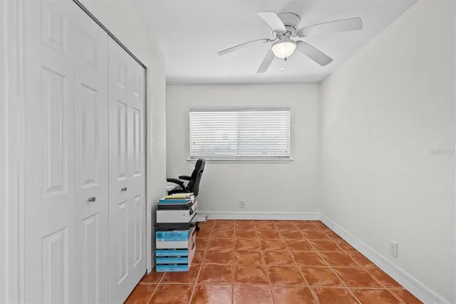 a living room with furniture a air conditioner vent and a window