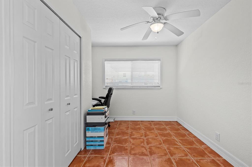 3391 Mangrove Drive Hernando Beach, FL 34607 - Photo 38 of 52 a view of an empty room and a ceiling fan