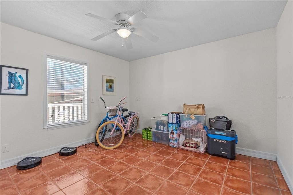 3391 Mangrove Drive Hernando Beach, FL 34607 - Photo 41 of 52 a living room with furniture a air conditioner vent and a window