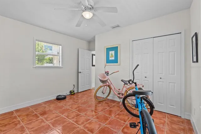 a view of a dinning table and chairs in patio of the house