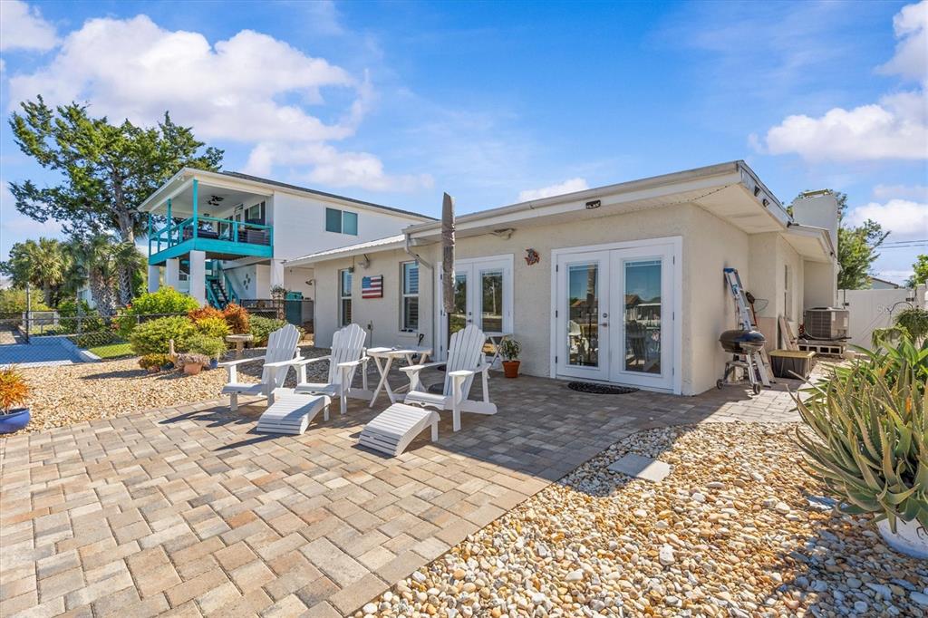 3391 Mangrove Drive Hernando Beach, FL 34607 - Photo 45 of 52 a view of a dinning table and chairs in patio of the house