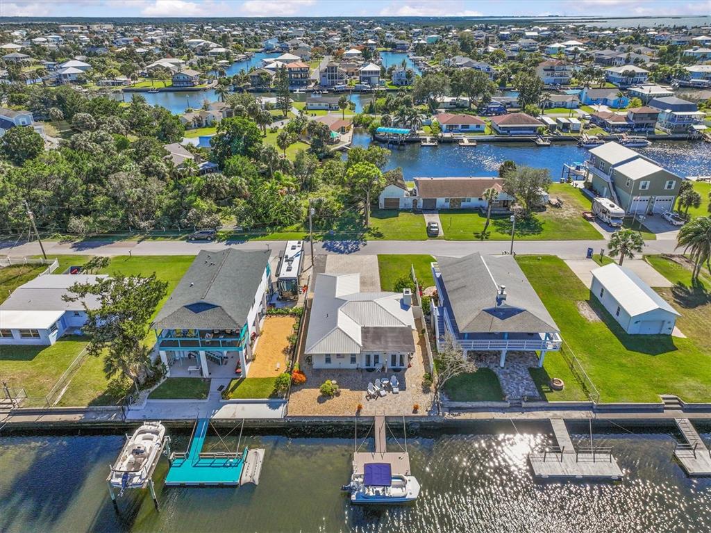 3391 Mangrove Drive Hernando Beach, FL 34607 - Photo 51 of 52 an aerial view of houses with yard